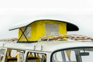 Restored Volkswagen T2 Camper featuring an uplifting roof for additional space and comfort