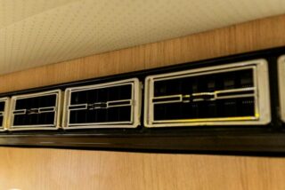 Restored Volkswagen T2 Camper with a built-in air conditioning system for comfort on every journey.