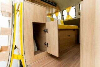 Custom storage solutions inside a restored Volkswagen T2 Camper, designed for convenience and organization