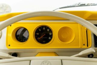 Interior view of a custom dashboard in a restored Volkswagen T2 Camper, upgraded for modern driving.
