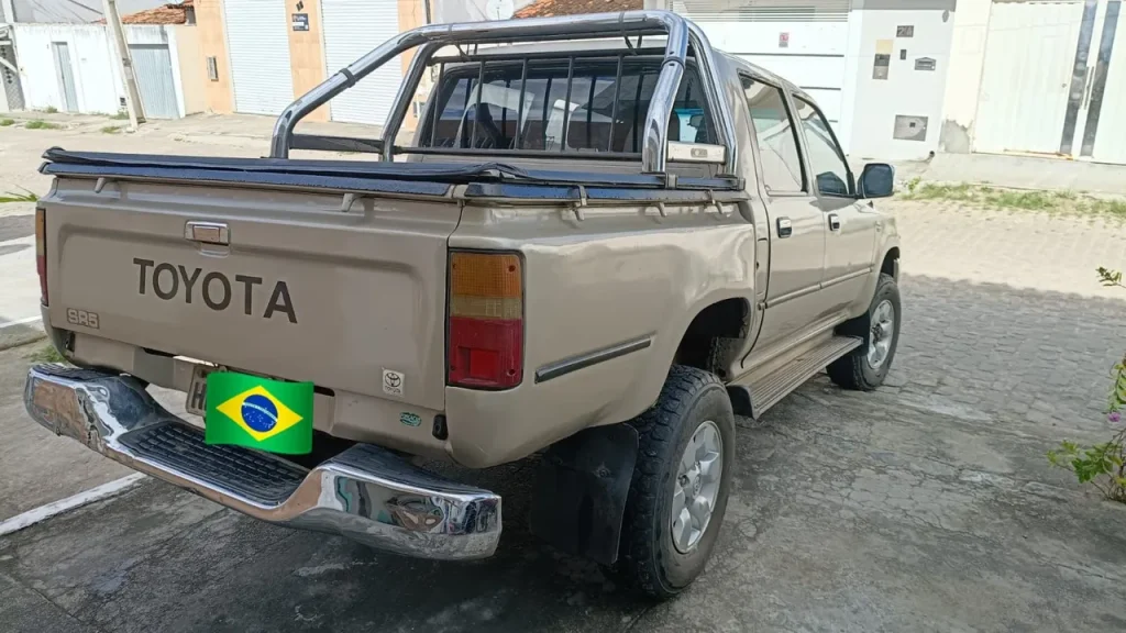 Toyota Hilux, front view parked outdoors.